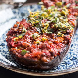 Baked eggplant with lentils, tomatoes and a herby topping