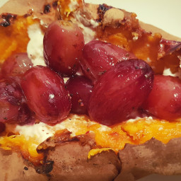 Baked sweet potato with roasted red grapes and goat cheese 