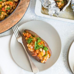 Baked sweet potato with spiced cannellini beans and vegetable stew