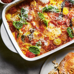 Baked tomatoes and eggs with basil, chilli and parmesan