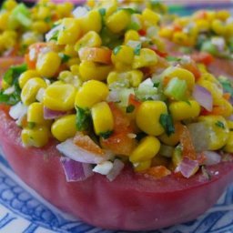 BEEF STEAK TOMATOES STUFFED WITH CORN AND HERB SALAD