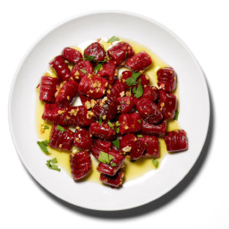 Beetroot gnocchi with butter, sage and orange sauce.
