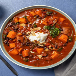 Black Bean and Sweet Potato Harissa Stew with Spinach, Flaked Almonds and Y