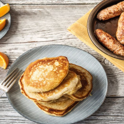 Breakfast Lemon Ricotta Pancakes with Sausage and Orange Wedges