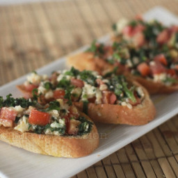 Bruschetta with spinach, tomato and cheese