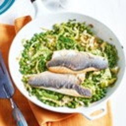 Buttery sea bass fillets with cider-braised greens
