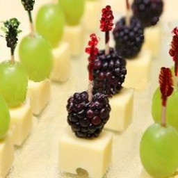 Cheese cubes with black raspberries and grapes