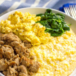Cheesy grits breakfast bowls with sausage, scrambled eggs and spinach