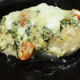 Chicken stuffed and topped with Spinach Artichoke Dip