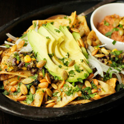 Chilaquiles With Pepitas, Charred Corn, and Black Beans Recipe