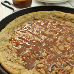 Chocolate Chip Skillet Cookie with Pecans and Bourbon Caramel Sauce