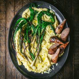 Creamy Cheddar Polenta with Sausage and Charred Ramps