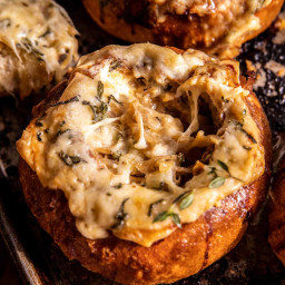 Creamy French Onion Soup Baked In Bread Bowls.
