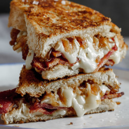 Crispy bacon brie grilled cheese sandwich with caramelised onions