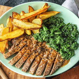 Crushed Peppercorn Steak with Creamed Kale and Potato Wedges