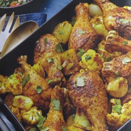 Curry roasted drumsticks with cauliflower and potatoes