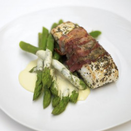 Delicious roasted white fish wrapped in smoked bacon with lemon mayonnaise 