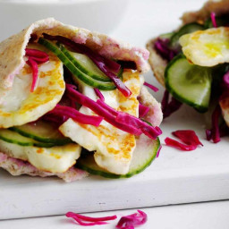 Halloumi-stuffed pittas with cucumber and pickled cabbage
