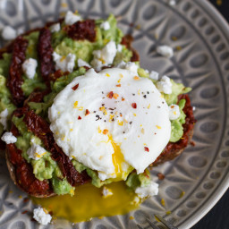 Harissa, Smashed Avocado + Egg Toast with Goat Cheese and Honey Drizzle.
