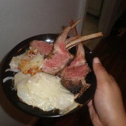 Herb-crusted Rack Of Lamb with Red Onions and Potatoes Au Gratin