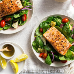 Lemon-pepper salmon over Greek salad with artichokes and olives
