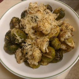 Oven Roasted Brussel Sprouts And Cauliflower Drizzled With Parmesan Cheese
