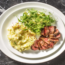 Pan-Fried Sirloin Steak with Black Garlic Butter, Mash and Pea Shoots Salad