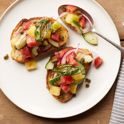 Panzanella Tomato Toast with Crispy Capers and Basil Leaves