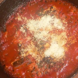 Pepper crusted fish in a mediterranean sauce