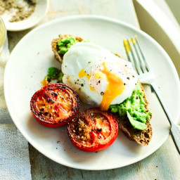 Poached eggs with smashed avocado and tomatoes