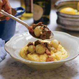 Pork With Onions and Prunes Over Polenta