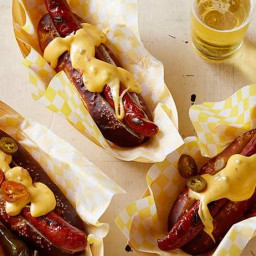 Pretzel Buns with Grilled Dogs and Spicy Cheese Sauce