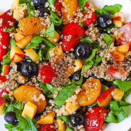 Quinoa salad with spinach, strawberries, and blueberries