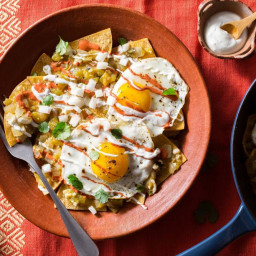 Red, white, and green chilaquiles with fried eggs