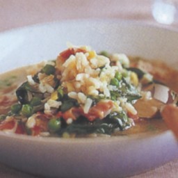 Rice soup with peas and spinach