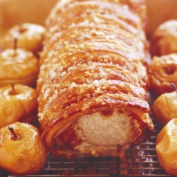 Roast loin of pork with crispy crackling and roasted apples