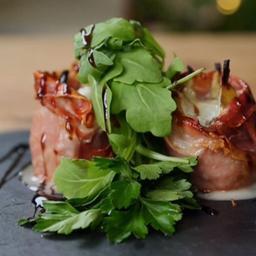 Roasted figs wrapped in Parma ham with blue cheese and rocket