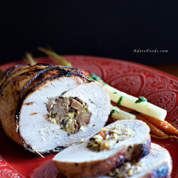 Roasted stuffed turkey breast with roasted carrots and asparagus and chimic