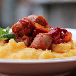 Sausage and Peppers over Creamy Parmesan Polenta
