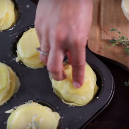 She Layers Thinly Sliced Potatoes in a Muffin Tin. What Comes Out the Oven 