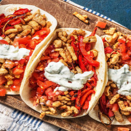 Sizzling Pork Fajitas with Roasted Peppers, Lime Crema and Salsa Fresca
