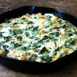 Skillet Strata with Bacon, Cheddar, and Greens