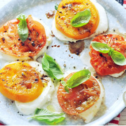 Sliced grilled heirloom tomatoes and mozzarella