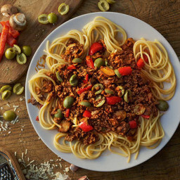 Spaghetti bolognese with a green olive twist