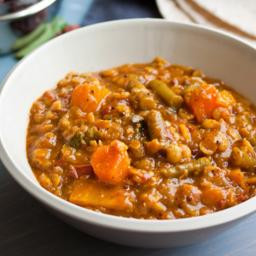 Spicy lentil soup with squash, tomato and green beans (sambar)