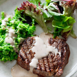 Steak with crushed peas & peppercorn sauce