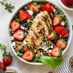 strawberry salad with goat cheese, grilled chicken, and maple balsamic vina