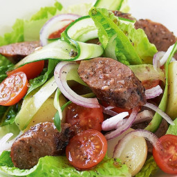 Warm sausage salad with pepper dressing