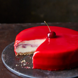 White chocolate and cherry cheesecake with a red mirror glaze