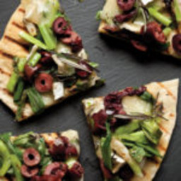 Wood-Grilled Spring Onion, Brie, and Kalamata Olive Pizza